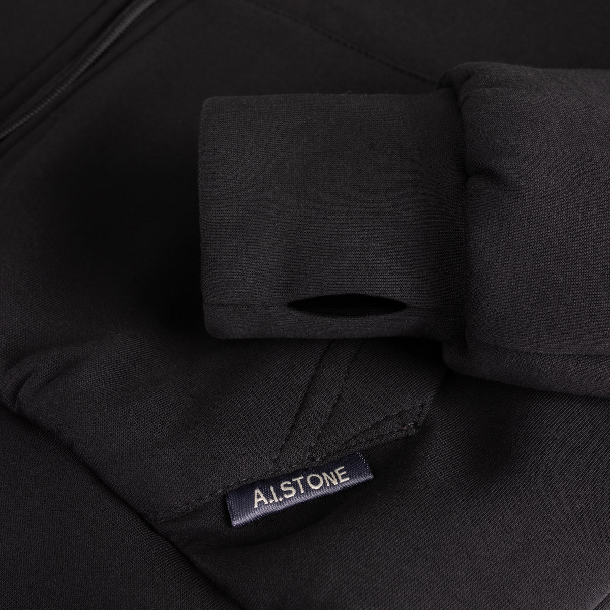 HALO Hoodie thumb-hole cuff and A.I.STONE pocket label